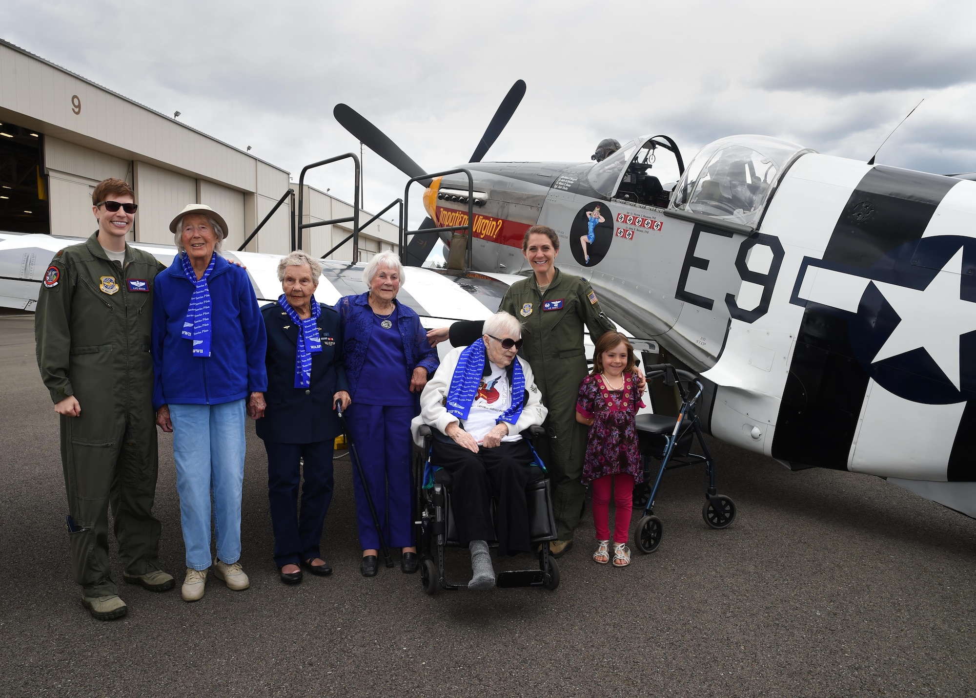 Four female Women Airforce Service Pilots and two McChord C-17 pilots stand in front of a P-51 Mustang on the McChord Field Flight line July 10, 2016, at Joint Base Lewis-McChord, Wash. Dorothy Olsen, WASP, celebrated her 100th birthday at McChord along with three fellow WASPs and their families at McChord. Olsen received a Congressional Gold Medal in March 2010 for her service during World War II. (Air Force Photo/Staff Sgt. Naomi Shipley)