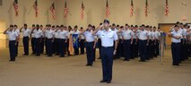 Lt. Col. Joseph McKenna, 2nd Operations Group deputy commander, leads 2nd OG Airmen in a salute to their new commander at Barksdale Air Force Base, La., July 7, 2016. The change of command ceremony is a military tradition that represents a formal transfer of authority and responsibility of a unit from one commanding officer to the next. (U.S. Air Force photo/Senior Airman Curt Beach)