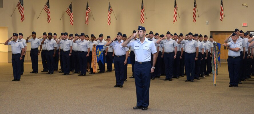 Lt. Col. Joseph McKenna, 2nd Operations Group deputy commander, leads 2nd OG Airmen in a salute to their new commander at Barksdale Air Force Base, La., July 7, 2016. The change of command ceremony is a military tradition that represents a formal transfer of authority and responsibility of a unit from one commanding officer to the next. (U.S. Air Force photo/Senior Airman Curt Beach)