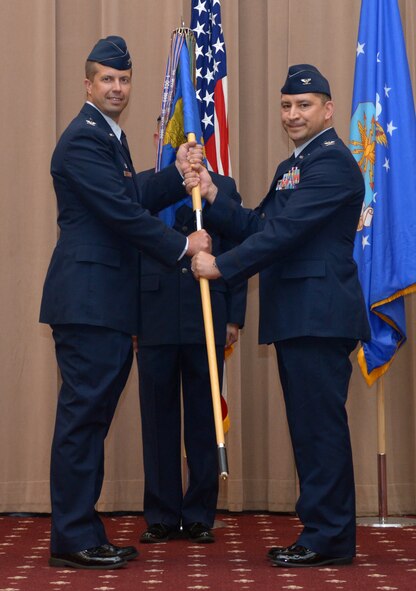 Col. Kurt Schendzielos assumes command of the 2nd Operations Group from Col. Ty Neuman, 2nd Bomb Wing commander, at Barksdale Air Force Base, La., July 7, 2016. The change of command ceremony is a military tradition that represents a formal transfer of authority and responsibility of a unit from one commanding officer to the next. Schendzielos previously served as chief, Nuclear Operations at Supreme Headquarters Allied Powers of Europe in Casteau, Belgium. Schendzielos has more than 2,000 flight hours, including 274 combat hours. (U.S. Air Force photo/Senior Airman Curt Beach)