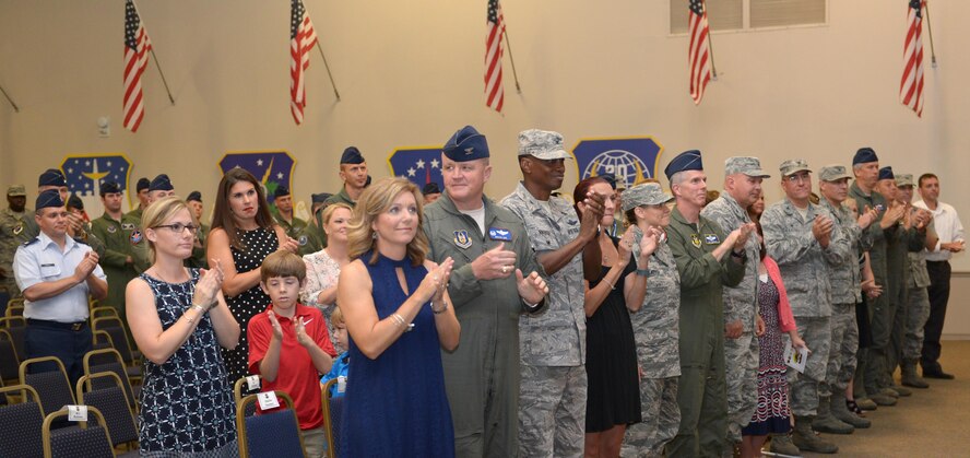 Airmen, family and friends applaud Col. Kurt Schendzielos on his new command, the 2nd Operations Group, after the change of command ceremony at Barksdale Air Force Base, La., July 7, 2016. Schendzielos previously served as chief, Nuclear Operations at Supreme Headquarters Allied Powers of Europe in Casteau, Belgium. (U.S. Air Force photo/Senior Airman Curt Beach)