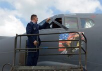Col. Kurt Schendzielos, 2nd Operations Group commander, removes the previous commander’s name from the 2nd OG flagship after a change of command ceremony at Barksdale Air Force Base, La., July 7, 2016. After every flying unit change of command, the previous commander's name is removed from the squadron flagship aircraft, and the new commander's name is revealed. Schendzielos previously served as chief, Nuclear Operations at Supreme Headquarters Allied Powers of Europe in Casteau, Belgium. (U.S. Air Force photo/Senior Airman Curt Beach)