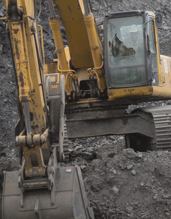 Cpl. Leon A. Demers, a motor vehicle operator with Detachment B, Marine Wing Support Squadron-472, Marine Aircraft Group 49, 4th Marine Aircraft Wing, Marine Forces Reserve, operates an excavator during a runway extension project at Innovative readiness training Old Harbor, Alaska, July 9, 2016. The project would extend the existing Old Harbor runway by 2,000 feet, which would allow larger aircraft to land in Old Harbor. IRT Old Harbor is part of a civil and joint military program to improve military readiness while simultaneously providing quality services to underserved communities throughout the United States. (U.S. Marine Corps photo by Sgt. Ian Leones/released)