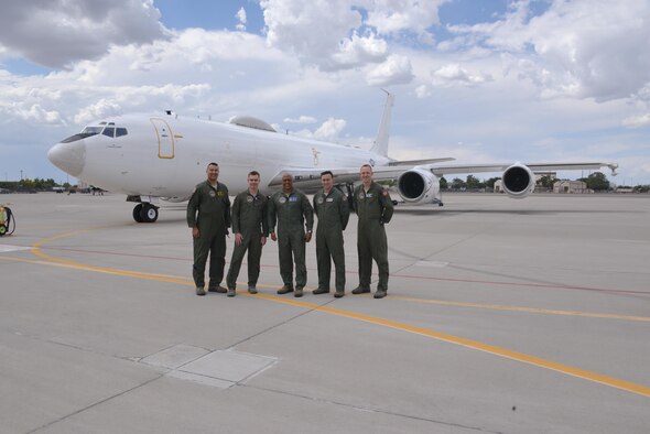 Maj. Gen. Anthony Cotton, 20th Air Force and Task Force 214 commander, center, takes a photo with, from left to right, Lt. Col. Christopher Picinni, Airborne National Command Post mission commander, Capt. Nate Larson, 90 Operations Support Squadron, Capt. Kerry Dubuisson, 91 Operations Support Squadron, Capt. Greg Carter, ALCS/Intel Officer and Strike Planner June 26, 2016.