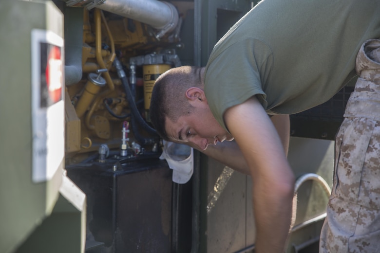 Lance Cpl. Michael L. Leclerc, an electrician with Detachment B, Marine Wing Support Squadron-472, Marine Aircraft Group 49, 4th Marine Aircraft Wing, Marine Forces Reserve, performs preventative maintenance on a power generator at Innovative Readiness Training Old Harbor, Alaska, July 11, 2016. The training brought the Marines back to their expeditionary roots and required them to setup electricity, water and other resources to survive in the remote Alaskan environment.  IRT Old Harbor is part of a civil and joint military program to improve military readiness while simultaneously providing quality services to underserved communities throughout the United States. (U.S. Marine Corps photo by Sgt. Ian Leones/released)