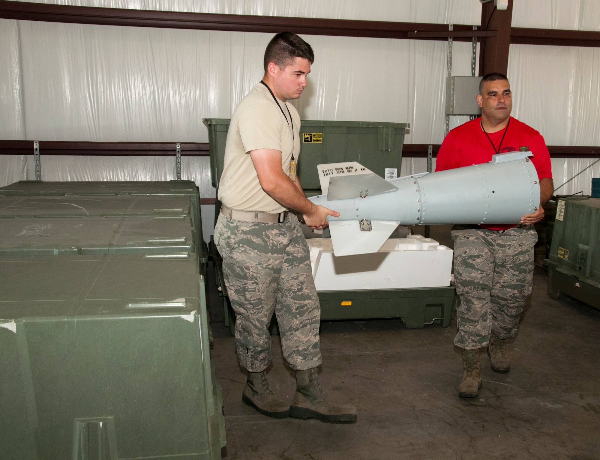 U.S. Air Force Airman 1st Class Randal Trosky, 1st Maintenance Squadron ordnance maintenance mechanic, trains with the 192nd Fighter Wing ammunitions specialist building eight Mark 83 inert bombs for an exercise commemorating Maj. Gen. Billy Mitchell’s bombing of the German battleship Ostfriesland, at Langley Air Force Base, Va., July 10, 2016. Mitchell was an outspoken advocate for the importance of airpower who was demoted from brigadier general to colonel and posthumously promoted to major general by former President Franklin D. Roosevelt.  (U.S. Air National Guard photo by Master Sgt. Carlos J. Claudio)