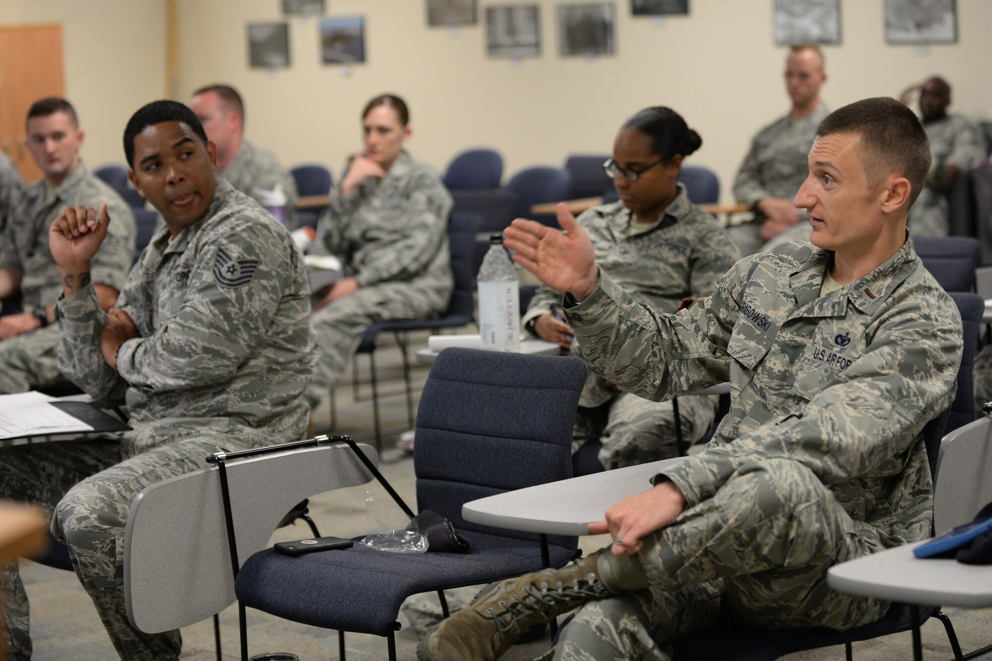 U.S Air Force officers and enlisted members participate in a guided discussion about leadership at Langley Air Force Base, Va., July 7, 2016. All members of the active duty community are encouraged to attend the leadership seminars hosted by Langley Club 5/6 as they compares leadership styles in today’s Air Force with those of leaders in World War II. (U.S. Air Force photo by Staff Sgt. Teresa J. Cleveland)