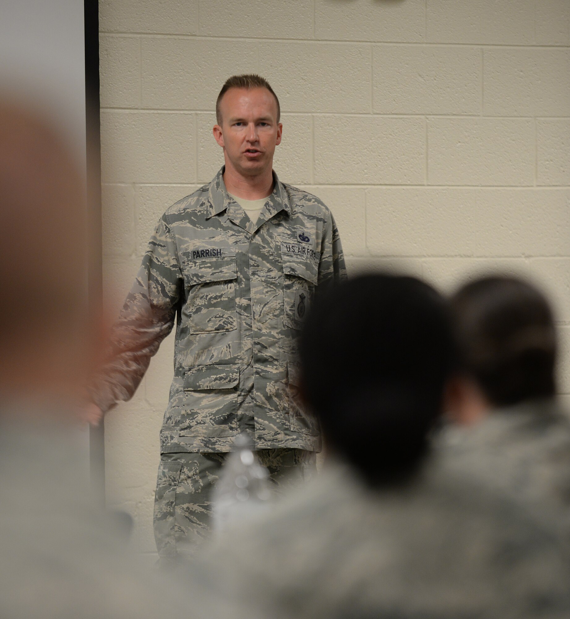 U.S. Air Force Tech. Sgt. Kristopher Parrish, 633rd Security Forces Squadron physical security NCO in charge and Club 5/6 professional development chairman, leads a guided discussion at Langley Air Force Base, Va., July 7, 2016. Langley Club 5/6 began hosting leadership seminars based on the TV miniseries “Band of Brothers” which aired in 2001. (U.S. Air Force photo by Staff Sgt. Teresa J. Cleveland)