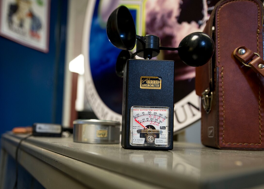 An anemometer is displayed in front of the 1st Operations Support Squadron weather office at Fort Eustis, Va., June 22, 2016. Weather forecasters use anemometer's to measure the speed of the wind, or of any current of gas by counting the number of rotations the vertical rod makes. (U.S. Air Force photo by Airman 1st Class Derek Seifert)