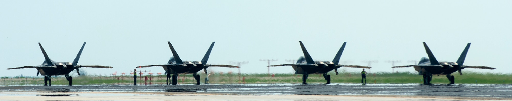 U.S. Air Force F-22 Raptors line up for takeoff at Langley Air Force Base, Va., July 7, 2016. The Raptors depart for Red Flag 16-3, a joint tactical air combat employment exercise held at Nellis Air Force Base, Nev. (U.S. Air Force photo by Airman 1st Class Kaylee Dubois)