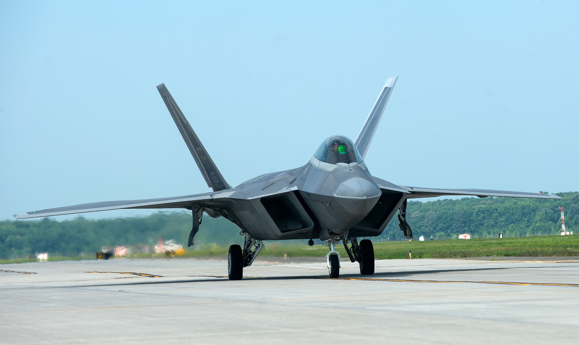 A U.S. Air Force F-22 Raptor takes off at Langley Air Force Base, Va., July 7, 2016. About 12 Raptors travelled to Nellis Air Force Base, Nev., to participate in Red Flag 16-3, training for the U.S. military members and allied forces to work together in realistic combat scenarios. (U.S. Air Force photo by Airman 1st Class Kaylee Dubois)