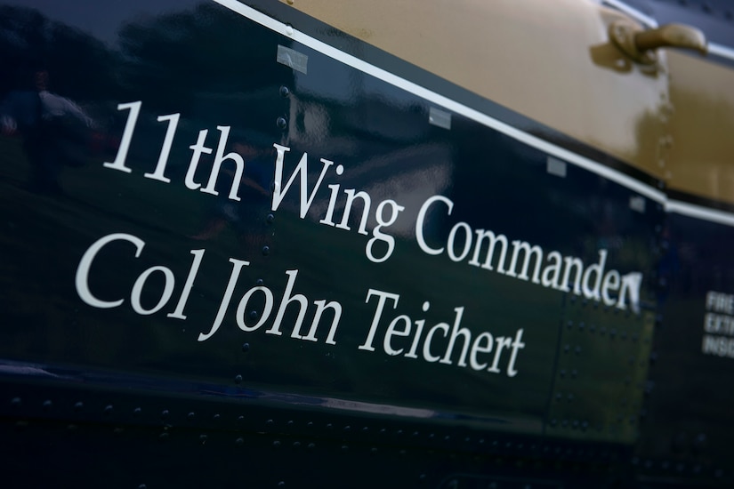 Col. John Teichert, the new 11th Wing and Joint Base Andrews commander, has his name revealed on the side of a 1st Helicopter Squadron UH-1N Huey helicopter during the change of command ceremony on the Ceremonial Lawn at Joint Base Anacostia-Bolling, Washington, D.C., July 12, 2016. Joint Base Andrews is home to two higher headquarters, six wings, more than 80 tenant organizations and an estimated 17,000 personnel. (U.S. Air Force photo by Airman 1st Class Philip Bryant)