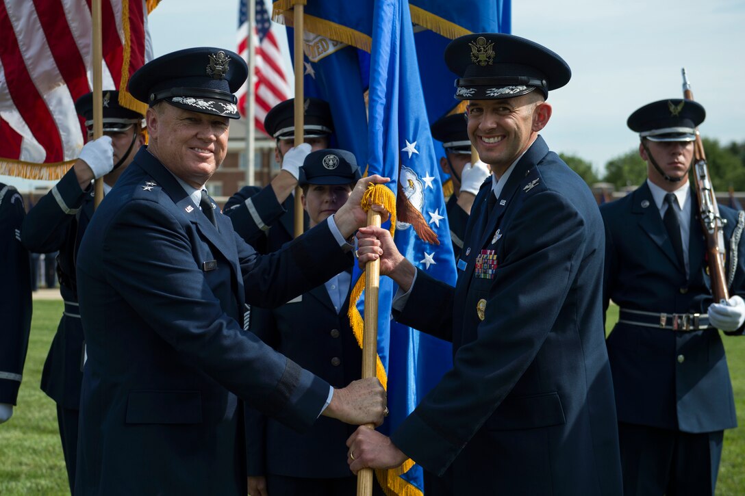 Col. John Teichert, the new 11th Wing and Joint Base Andrews commander, assumes command of the 11th Wing and Joint Base Andrews at Joint Base Anacostia-Bolling, Washington, D.C., July 12, 2016. Teichert took over command from Col. Bradley Hoagland and is now responsible for approximately 2,500 Airmen, DOD civilians and contractors in the 11th WG. (U.S. Air Force photo by Airman 1st Class Philip Bryant)
