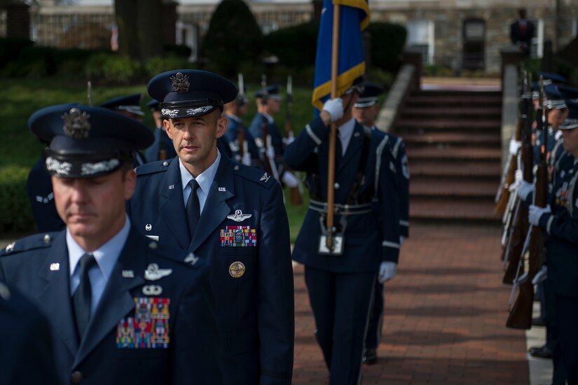 Col. John Teichert, the new 11th Wing and Joint Base Andrews commander, walks through an honor guard cordon before the 11th WG change of command on the Ceremonial Lawn at Joint Base Anacostia-Bolling, Washington, D.C., July 12, 2016. Teichert took over command from Col. Bradley Hoagland and is now responsible for approximately 2,500 Airmen, DOD civilians and contractors in the 11th WG. (U.S. Air Force photo by Airman 1st Class Philip Bryant)