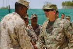 U.S. Army Gen. Joseph Votel Commander of U.S. Central Command, meets with U.S. Marine Sgt. Maj. Clifford Wiggins, Command Sgt. Maj. 5th Marine Expeditionary Brigade, and members of the Jordanian Armed Forces during Exercise Eager Lion 16 near Amman, Jordan on May 22, 2016. Eager Lion 16 is a US military bi-lateral exercise with the Hashemite Kingdom of Jordan designed to strengthen relationships and interoperability between partner nations. (U.S. Marine Corps photo by Cpl. Lauren Falk 5th MEB COMCAM/Released)