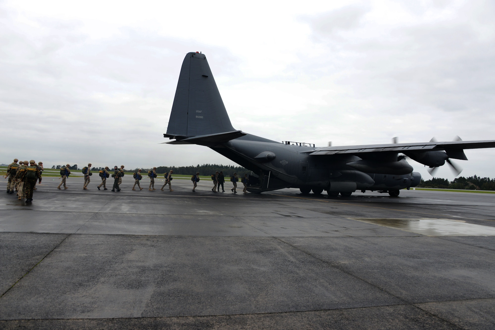 Jumpers from the Royal New Zealand Parachute Training and Support Unit load an MC-130H Combat Talon II June 20, 2016 at Royal New Zealand Air Force Base Auckland.  The jumpers were completing their initial parachutist training.  (U.S. Air Force photo by Master Sgt. Kristine Dreyer)