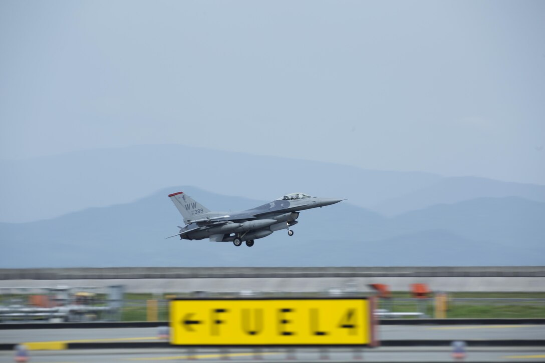 A U.S. Air Force F-16 fighter jet from Misawa Air Base, Japan, lands on the runway at Marine Corps Air Station Iwakuni on July 12, 2016. Multiple F-16’s arrived at MCAS Iwakuni to refuel while in transit to Okinawa, Japan. The F-16 is a compact, multi-role fighter aircraft, whose maneuverability and combat radius exceeds that of all potential threat fighter aircraft. (U.S. Marine Corps photo by Lance Cpl. Donato Maffin/Released)