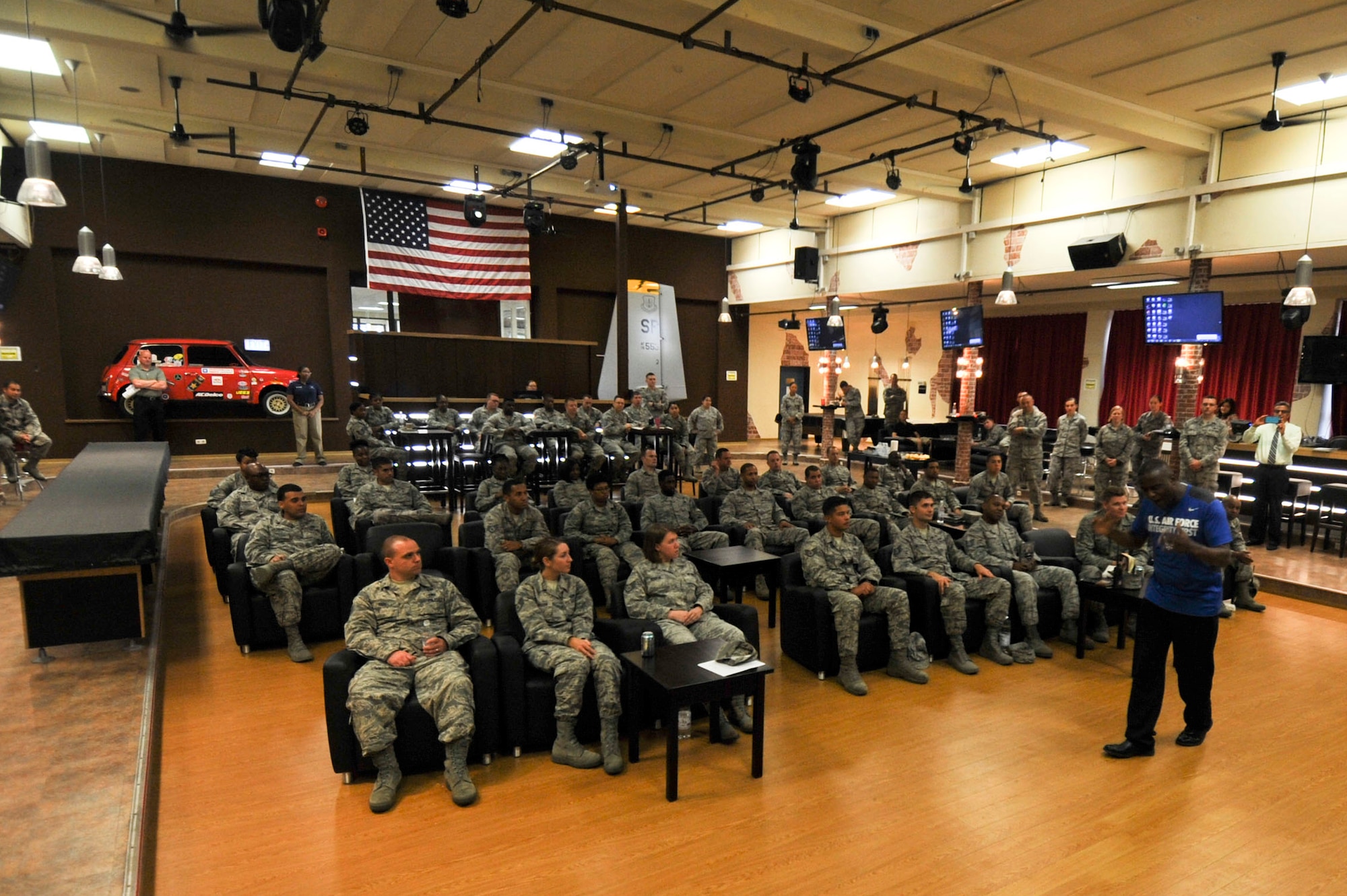 Retired U.S. Air Force Chief Master Sgt. Juan Lewis, known as the Fired Up Chief, speaks to NCOs during a Tier II private organization meeting at the Brick House on Spangdahlem Air Base, Germany, July 12, 2016. Lewis spoke to NCOs about PEP, meaning pride, enthusiasm and passion, as part of his pep rally presentation. (U.S. Air Force Photo by Staff Sgt. Joe W. McFadden/Released)