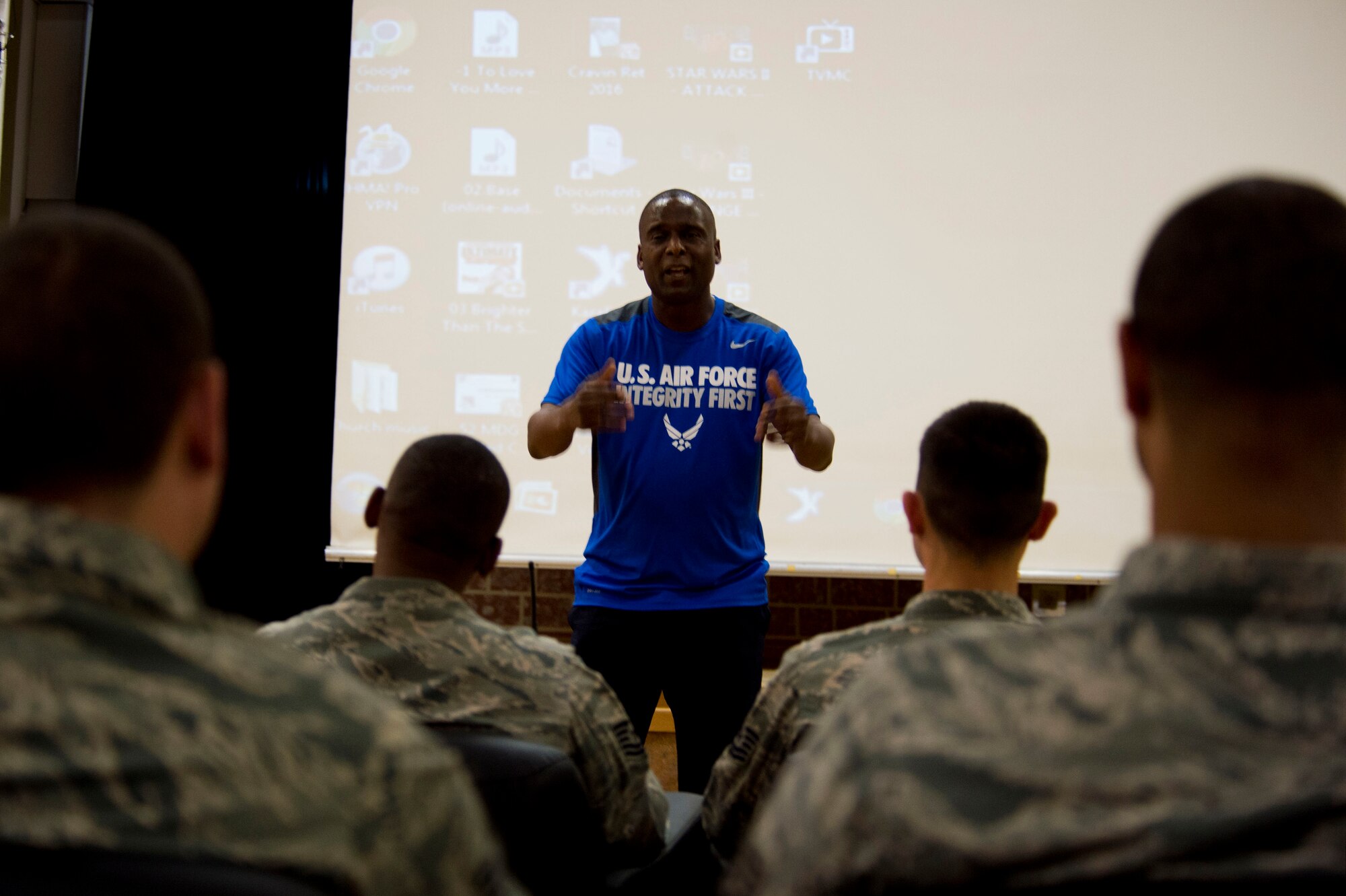 Retired U.S. Air Force Chief Master Sgt. Juan Lewis, known as the Fired Up Chief, speaks to NCOs during a Tier II private organization meeting at the Brick House on Spangdahlem Air Base, Germany, July 12, 2016. Lewis retired in 2012 after 28 years of military service. (U.S. Air Force Photo by Staff Sgt. Joe W. McFadden/Released)
