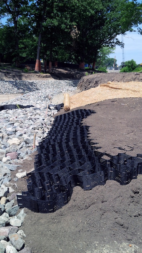 Note the geocells and turf reinforcement mattress being installed – early July 2015.