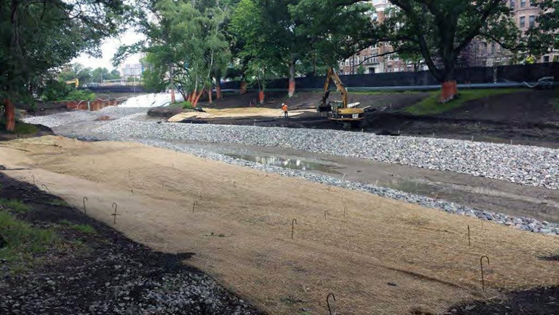 Bank stabilization/construction with stone protection; geocells; loam; and turf reinforcement mattress at Upper Fens Pond – early July 2015.