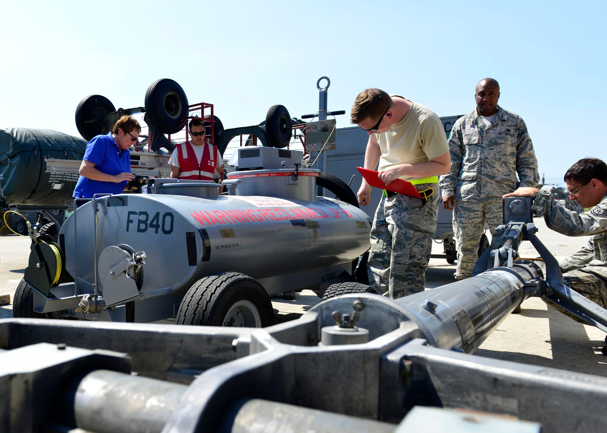 Team Aviano members inspect cargo, June 29, 2016, at Aviano Air Base, Italy, in preparation for Exercise Red Flag 16-3 at Nellis Air Force Base, Nev. Airmen from the 31st Maintenance Group, 31st Logistics Readiness Squadron and 724th Air Mobility Squadron teamed up to inspect and clear all cargo before it was flown to Nellis AFB for the exercise. (U.S. Air Force photo by Airman 1st Class Cary Smith/Released)