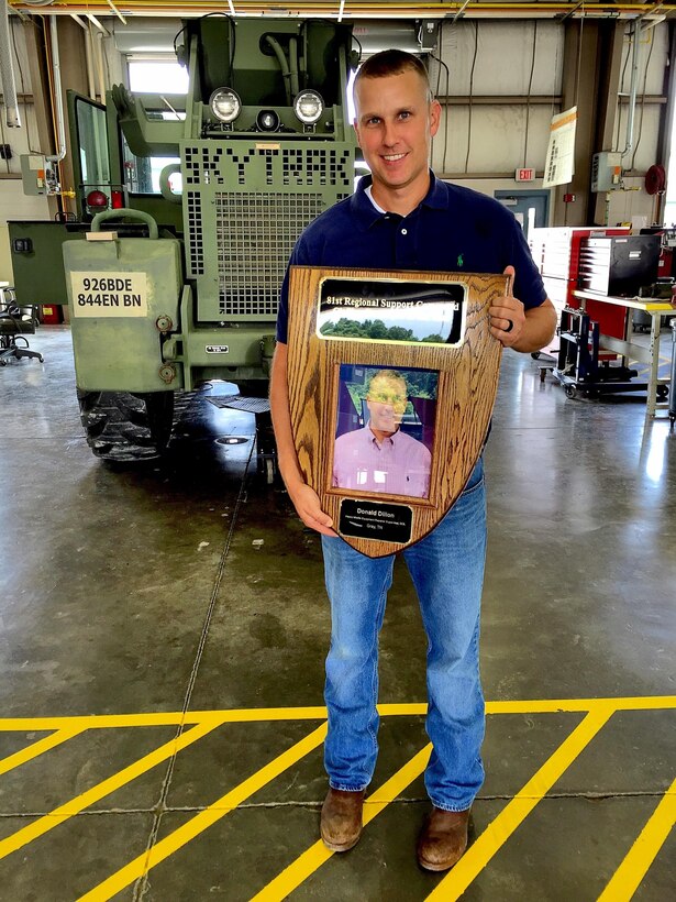 The Area Maintenance Support Activity (AMSA) 147 G Shop Supervisor Donald Dillon received his plaque for 81st Regional Support Command Civilian of the Year in June. 81st Regional Support Command Director of Logistics Ardis Ferguson and his deputy, Gregg Charvoz presented Dillon the award and the Commanders Civilian Award while presenting the AMSA with the USARC-level Army Award for Maintenance Excellence.