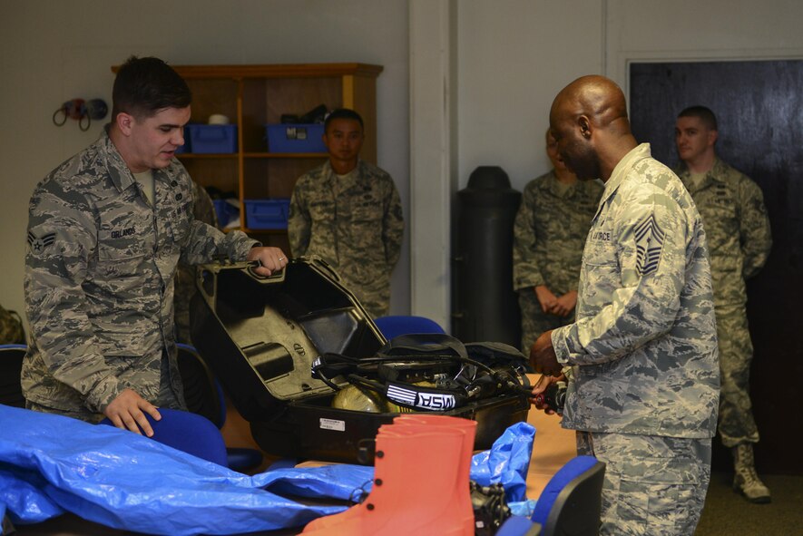 U.S. Air Force Senior Airman Alexander Orlando, 39th Civil Engineer Squadron logistics section, shows Chief Master Sgt. Vegas Clark, 39th Air Base Wing command chief, emergency management equipment July 13, 2016, at Incirlik Air Base, Turkey. The equipment is used for collecting and sampling evidence and substances. (U.S. Air Force photo by Tech. Sgt. Caleb Pierce)