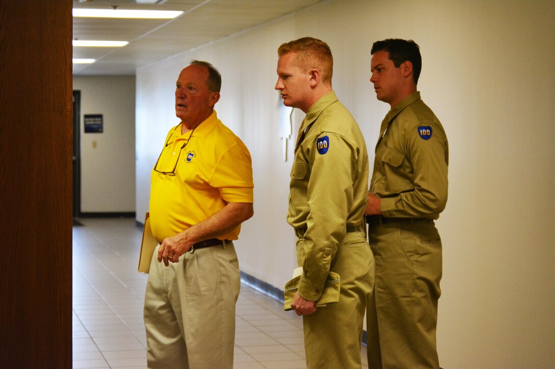 Former 100th Training Division Commander, Maj. Gen. (retired) Bill Barron, escorts Tom Kelly and Josh Kerner, around the 100th Division museum, located at the current 100th Training Division headquarters at Fort Knox, KY, during the unit's annual leadership readiness training. Kelly and Kerner, founded the 100th Infantry Division (reenacted), a civilian organization that uses authentic uniforms and equipment to accurately and respectfully recreate WW II events pertaining to the 100th ID.