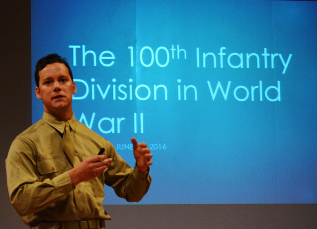 Tom Kelly paints a vivid picture of brutal ground combat mixed with an insurmountable dedication to duty, honor, and country fulfilled by 100th Infantry Division Soldiers during a presentation before Army Reserve Soldiers currently assigned to the 100th Training Division headquarters. Kelly and his partner Joshua Kerner, founded the 100th Infantry Division (reenacted), a civilian organization that uses authentic uniforms and equipment to accurately and respectfully recreate WW II events pertaining to the 100th ID.