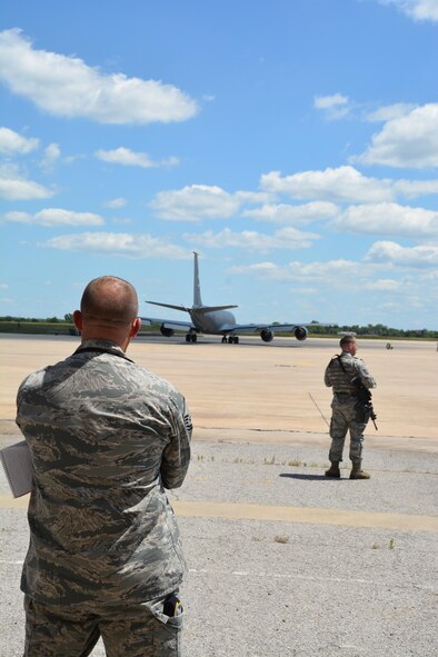 Master Sgt. Ricky Buettner, 507th Security Forces Squadron Wing Inspection Team, evaluates and observes security procedures on the Tinker Air Force Base flight line   June 5, 2016. while Tech Sgt. David Whisenhunt, 507th Security Forces Squadron mans the entry control point. (U.S. Air Force Photo/Maj. Jon Quinlan) 