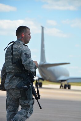 Tech. Sgt. David Whisenhunt, 507th Security Forces Squadron mans the entry control point on the Tinker Air Force Base flight line while KC-135R Stratotankers taxi in response to an exercise input during the June Operational Exercise June 5, 2016. (U.S. Air Force Photo/Maj. Jon Quinlan)   