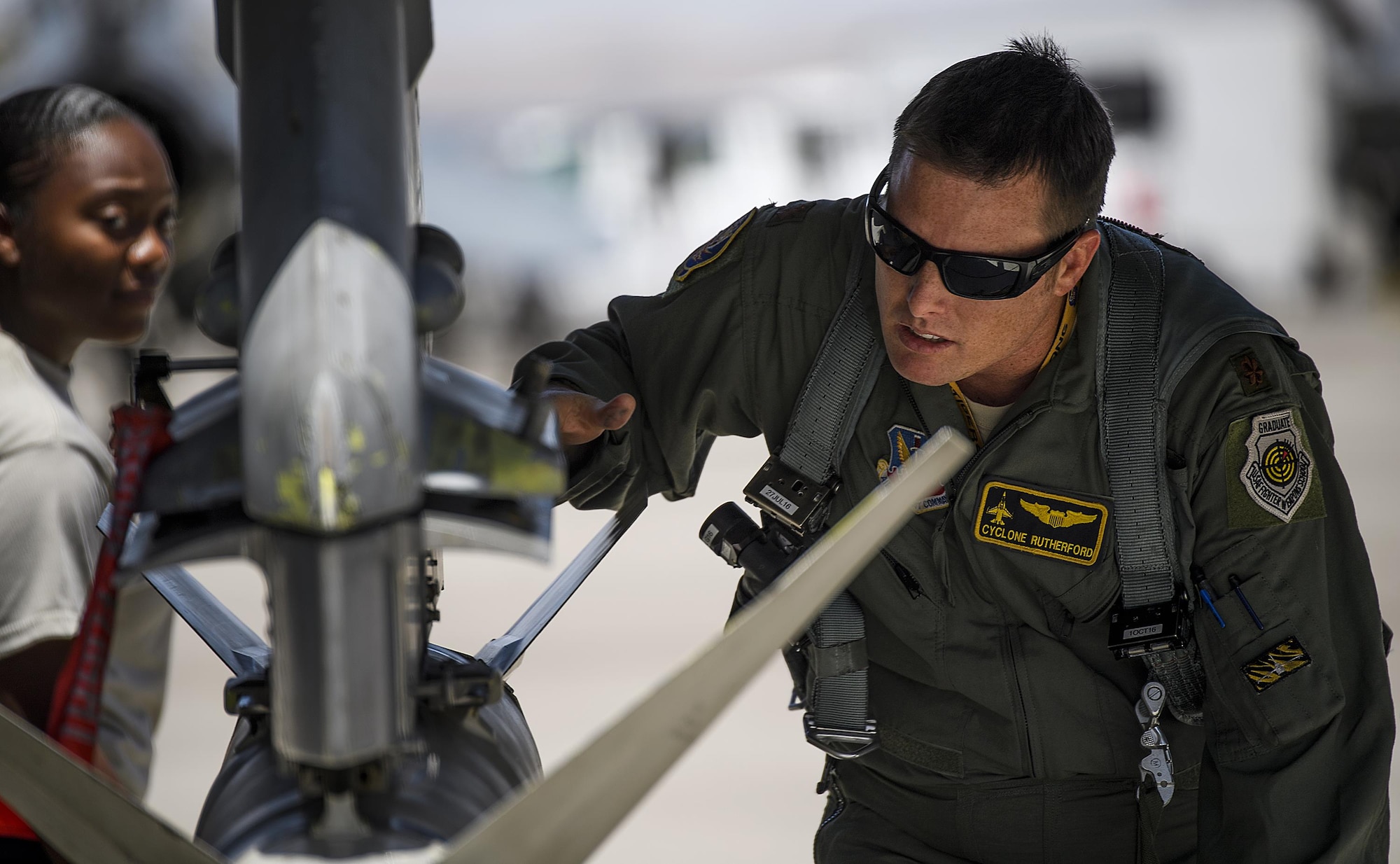 Maj. Kyle Ruthford, an F-16 Fighting Falcon pilot from Shaw Air Force Base's 79th Fighter Squadron, conducts pre-flight inspections day 1 of Red Flag, July 11, 2016 at Nellis Air Force Base, Nevada. The exercise will test participants’' ability to operate in air, cyberspace and space. (U.S. Air Force photo/Tech. Sgt. David Salanitri)