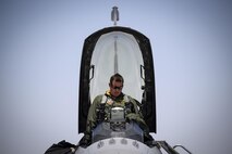 Maj. Kyle Ruthford, an F-16 Fighting Falcon pilot from Shaw Air Force Base's 79th Fighter Squadron, climbs into his jet day 1 of Red Flag, July 11, 2016 at Nellis Air Force Base, Nevada. The exercise will test participants’' ability to operate in air, cyberspace and space. (U.S. Air Force photo/Tech. Sgt. David Salanitri)
