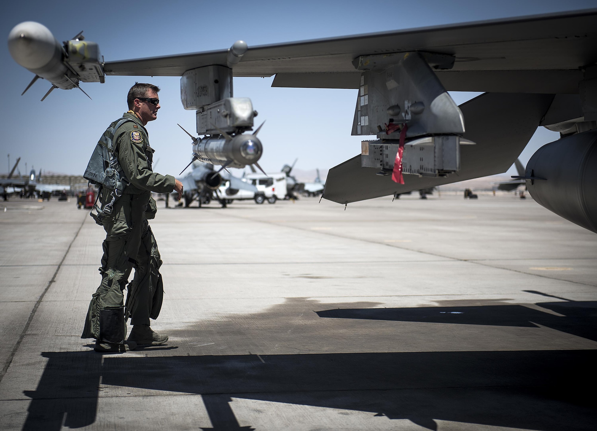 Maj. Kyle Ruthford, an F-16 Fighting Falcon pilot from Shaw Air Force Base's 79th Fighter Squadron, conducts pre-flight inspections day 1 of Red Flag, July 11, 2016 at Nellis Air Force Base, Nevada. More than 100 aircraft from 25 different joint units will participate in the exercise. (U.S. Air Force photo/Tech. Sgt. David Salanitri)
