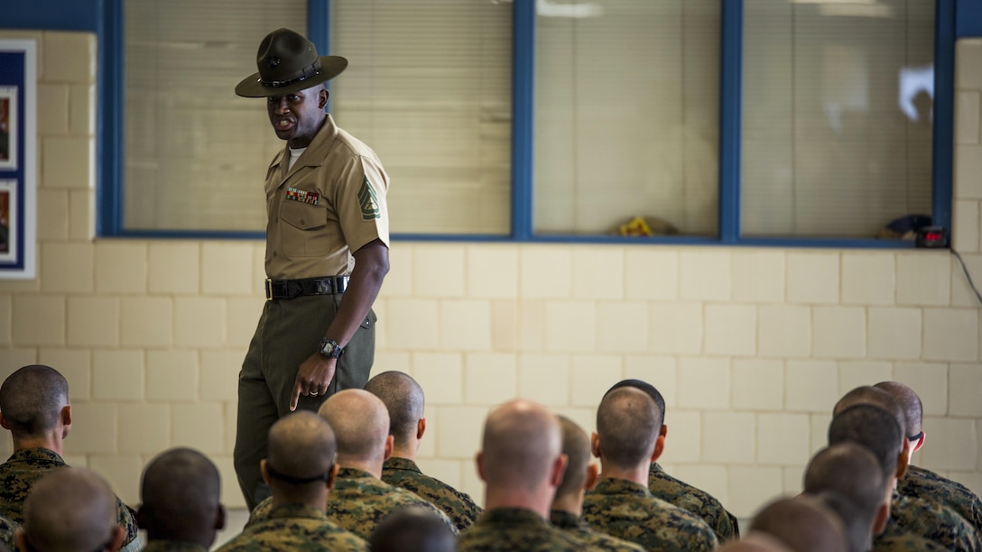 Senior Drill Instructor Gunnery Sgt. Adaecus G. Brooks introduces himself to the recruits of platoon 3064, India Company, 3rd Recruit Training Battalion, June 11, 2016, at Recruit Training Depot Parris Island, South Carolina. Brooks, 31, is from Baltimore. India Company is scheduled to graduate Sept. 2, 2016. Parris Island has been the site of Marine Corps recruit training since Nov. 1, 1915. Today, approximately 19,000 recruits come to Parris Island annually for the chance to become United States Marines by enduring 12 weeks of rigorous, transformative training. Parris Island is home to entry-level enlisted training for approximately 49 percent of male recruits and 100 percent of female recruits in the Marine Corps. 
