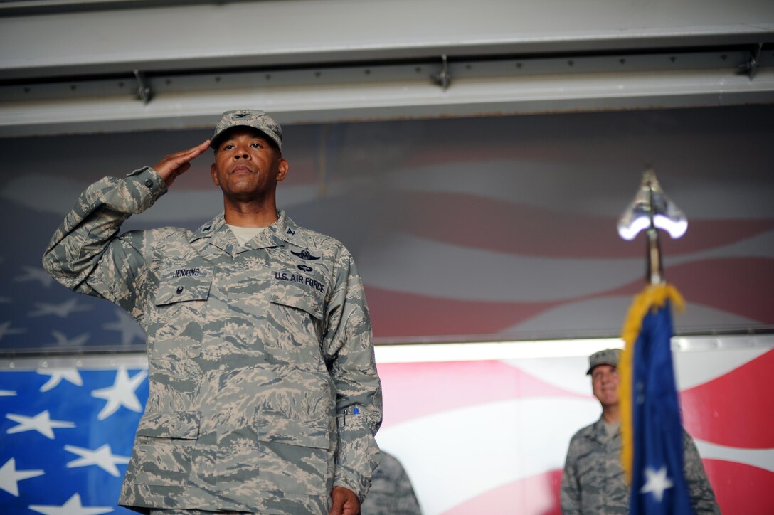 Col. Eric Jenkins, 916th Air Refueling Wing commander, renders his first salute to the Airmen of the 916th during a change of command ceremony, July 10, 2016, at Seymour Johnson Air Force Base, North Carolina. During the ceremony, Jenkins took command of the 916th ARW from Col. Craig B. Shenkenberg, who served the 916th as both its wing commander and vice wing commander. (U.S. Air Force Photo by Senior Airman Jeramy Moore/Released) 