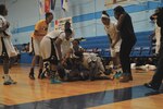 The All-Army Women’s Basketball Team vaults on U.S. Army Spc. Vanessa Lamison after her 3-pointer clinched a 67-65 victory over the All-Navy Women’s Basketball Team for the Army’s second consecutive Armed Forces Women’s Basketball Championship July 7, 2016, at the Chaparral Fitness Center.
