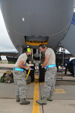 Senior Airman Nathalie Hamilton and Jose Gonzales, both crew chiefs with the 507th Aircraft Maintenance Squadron, complete a checklist during the June Operational Exercise June 3, 2016, at Tinker Air Force Base, Okla. (U.S. Air Force Photo/Tech Sgt. Lauren Gleason)