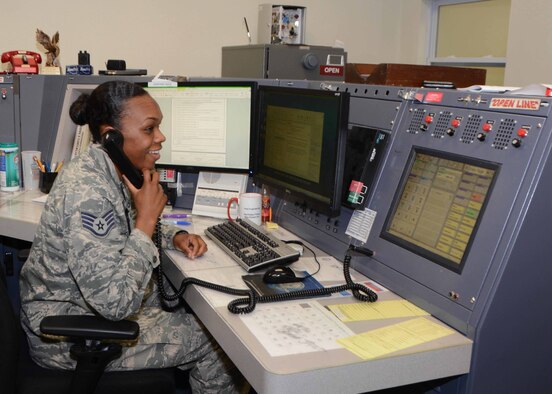 Staff Sgt. Shantel Ellis, 507th Air Refueling Wing command post controller coordinates with maintenance during the June Operational Exercise at Tinker Air Force Base, Okla. June 2, 2016. Command post controllers along with maintenance professionals in the maintenance operations control center were tested by running numerous checklists, relaying command information, tracking aircraft, answering radio and phone calls while dispatching crews. (U.S. Air Force Photo/Tech Sgt. Lauren Gleason)