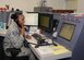 Staff Sgt. Shantel Ellis, 507th Air Refueling Wing command post controller coordinates with maintenance during the June Operational Exercise at Tinker Air Force Base, Okla. June 2, 2016. Command post controllers along with maintenance professionals in the maintenance operations center were tested by running numerous checklists, relaying command information, tracking aircraft, answering radio and phone calls while dispatching crews. (U.S. Air Force Photo/Tech Sgt. Lauren Gleason)