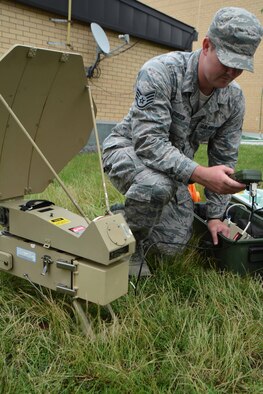 Staff Sgt. Colten Gibson of the 507th Air Refueling Wing Command Post configures a SCAMP (Single Channel Anti-Jam Man Portable) terminal during the June Operational Exercise at Tinker Air Force Base, Okla. The primary mission of SCAMP is to provide survivable extended-range communications to tactical units for command and control. (U.S. Air Force Photo/Tech Sgt. Lauren Gleason)