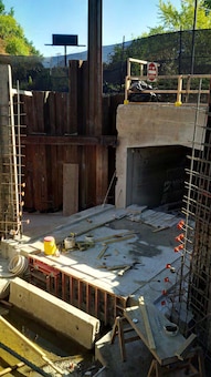 Note the new invert slab and the formwork and rebar for the wingwalls of the new precast concrete culvert extension – early October 2015.