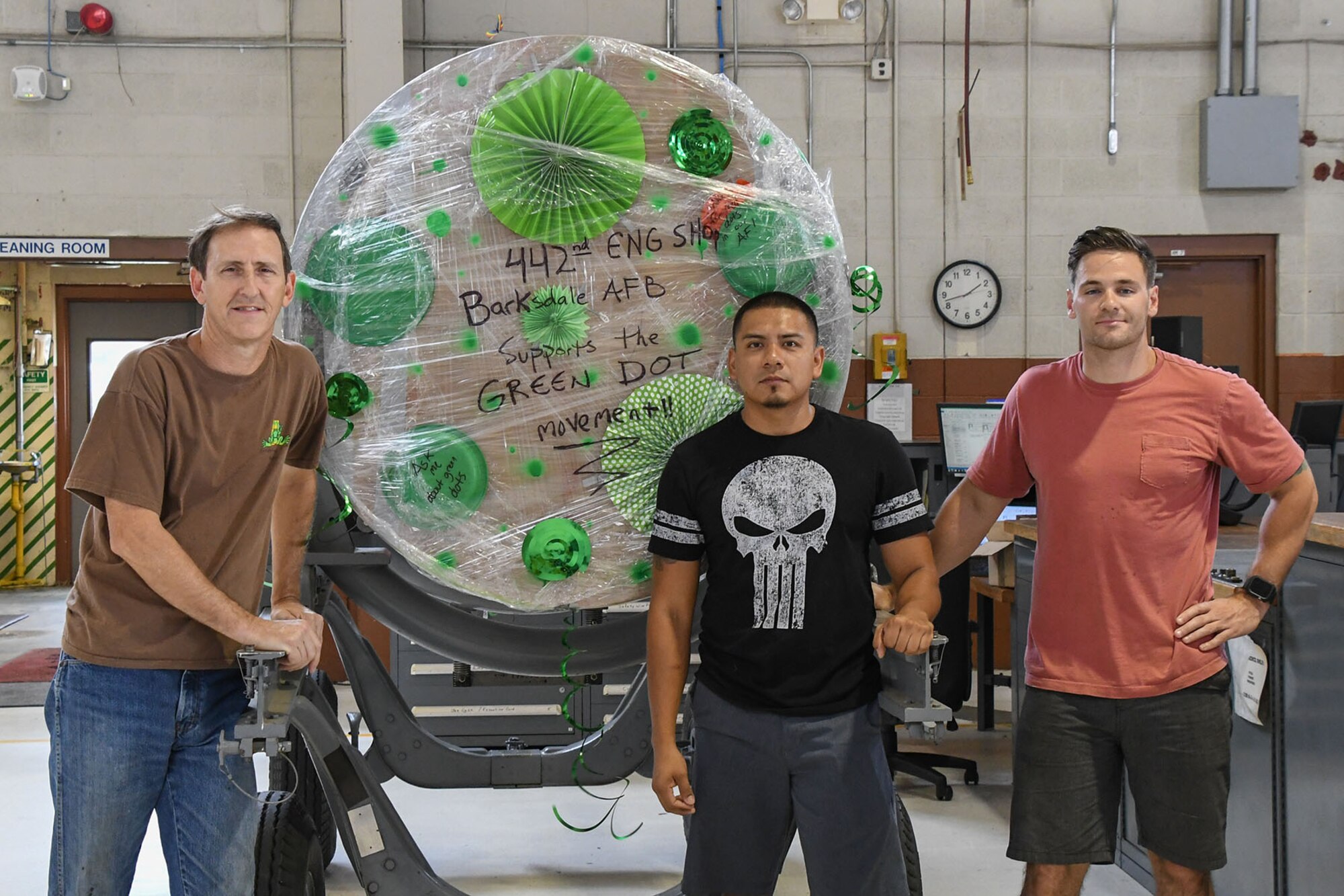 Master Sgt. William George Jr, propulsion shop supervisor,Tech. Sgt. Benjamin Laravie and Senior Airman Victor Cuevas, jet engine technicians, assigned to the 442nd Maintenance Squadron Operating Location Alpha at Barksdale Air Force Base, La., display their support for Green Dot by decorating the jet engine wrapping with green dots July 6, 2016. Green Dot prepares organizations to implement violence prevention that reduces power-based interpersonal violence, which includes not only sexual violence, but also domestic violence, dating violence, stalking, child abuse, elder abuse, and bullying.
(Information in this caption provided by the Secretary of the Air Force Public Affairs, Courtesy photo)