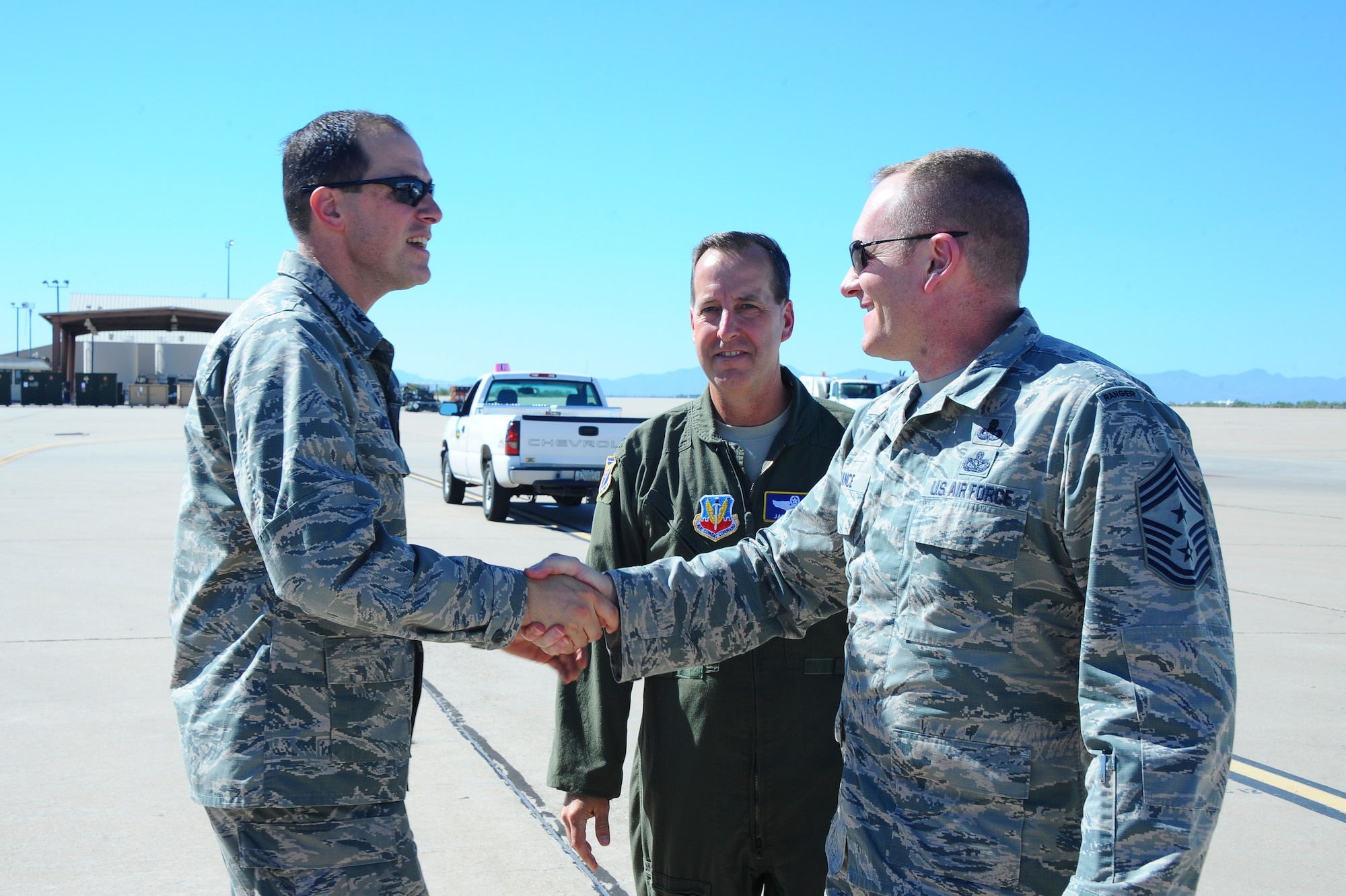 U.S. Air Force Col. James Meger, 355th Fighter Wing commander greets Chief Master Sgt. Jason France, command chief of Air Force Materiel Command, at Davis-Monthan Air Force Base, Ariz., July 12, 2016. AFMC employs some 80,000 personnel and manages $60 billion annually. (U.S. Air Force photo by Airman 1st Class Mya M. Crosby/Released)