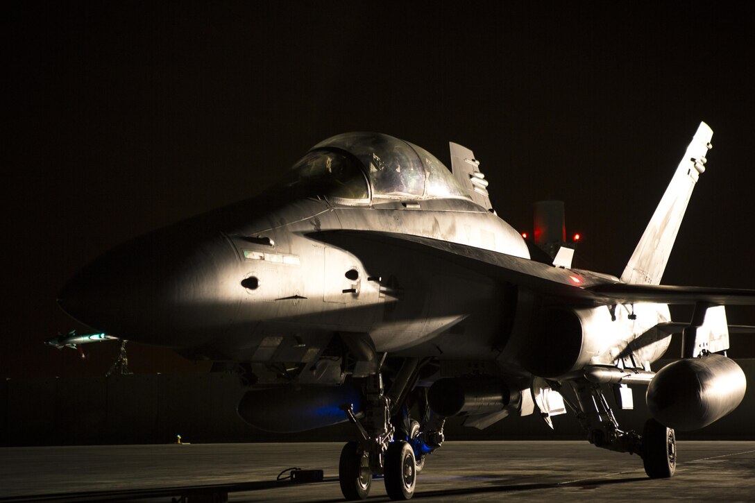 An F/A-18D Hornet assigned to Marine All-Weather Fighter Attack Squadron 533, Special Purpose Marine Air Ground Task Force - Crisis Response - Central Command 16.2, returns to an undisclosed location in Southwest Asia, June 8, 2016. VMFA(AW)-533 operates and conducts strikes as part of the Aviation Combat Element of SPMAGTF-CR-CC in support of Operation Inherent Resolve, the operation to eliminate the ISIL terrorist group and the threat they pose to Iraq, Syria, and the wider international community. (U.S. Marine Corps photo by Sgt. Donald Holbert/ Released)