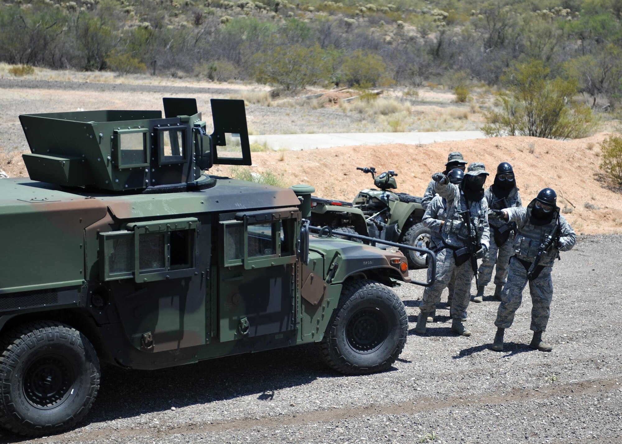 720th Security Forces Squadron members train in triple-digit heat during a drill weekend at Davis-Monthan Air Force Base, Ariz., June 4. They work alongside the 943rd Rescue Group to support active-duty and Air Force Reserve missions. Their parent unit is the 920th Mission Support Group at Patrick Air Force Base, Fla. (U.S. Air Force photo by Tech. Sgt. Carolyn Herrick)