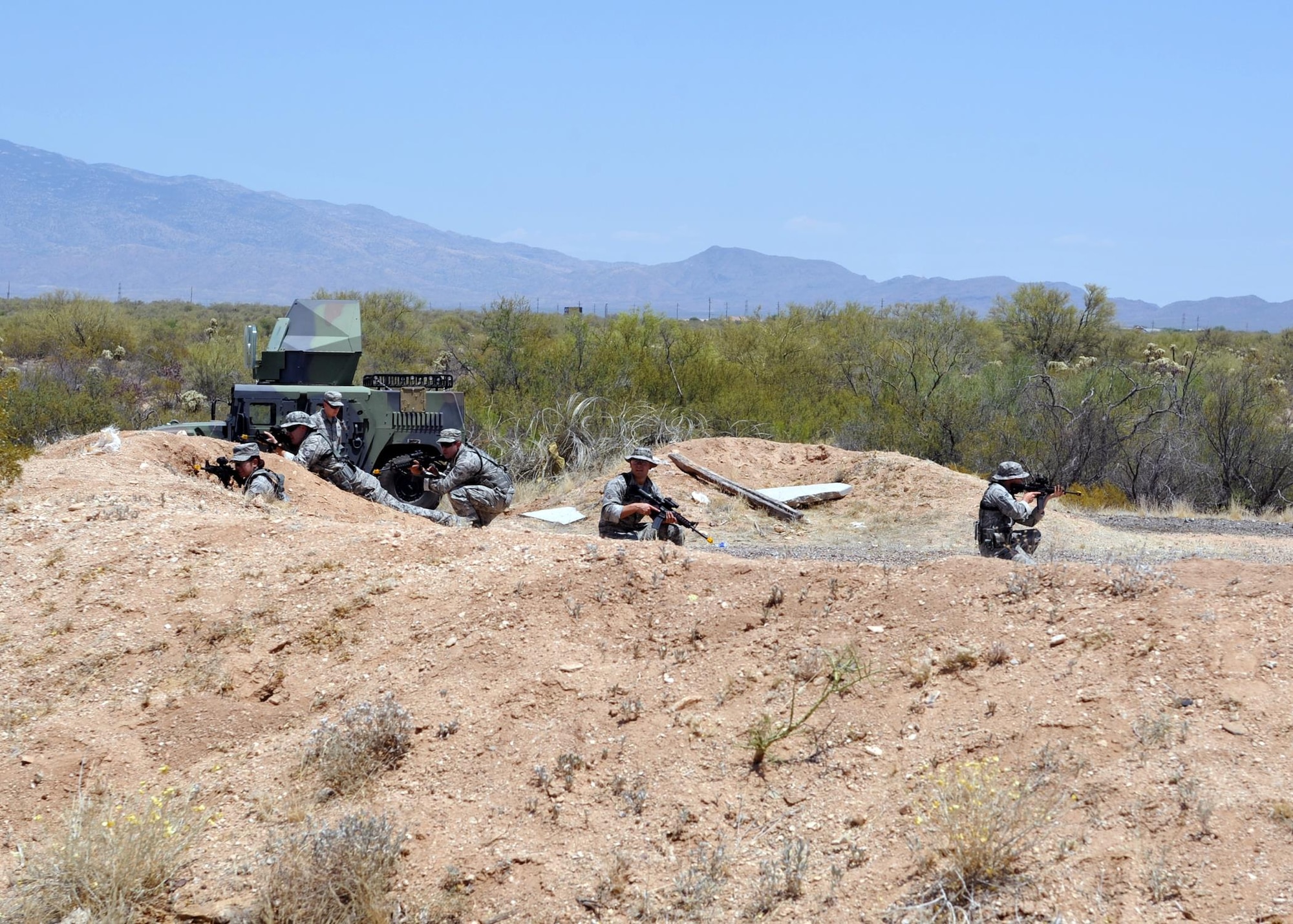 720th Security Forces Squadron members train in triple-digit heat during a drill weekend at Davis-Monthan Air Force Base, Ariz., June 4. They work alongside the 943rd Rescue Group to support active-duty and Air Force Reserve missions. Their parent unit is the 920th Mission Support Group at Patrick Air Force Base, Fla. (U.S. Air Force photo by Tech. Sgt. Carolyn Herrick)