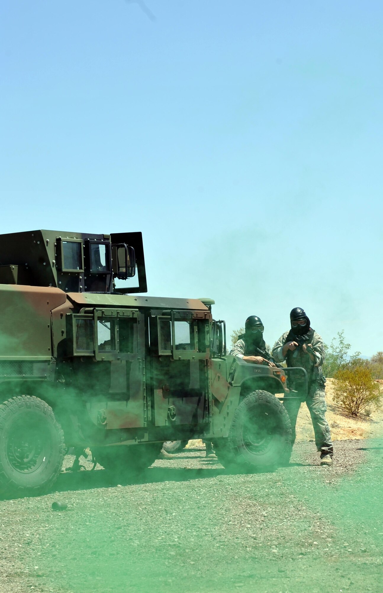 720th Security Forces Squadron members train in triple-digit heat during a drill weekend at Davis-Monthan Air Force Base, Ariz., June 4. They work alongside the 943rd Rescue Group to support active-duty and Air Force Reserve missions. Their parent unit is the 920th Mission Support Group at Patrick Air Force Base, Fla. (U.S. Air Force photo by Tech. Sgt. Carolyn Herrick)