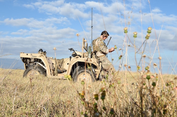 An Air Force combat controller with the 320th Special Tactics Squadron collects wind data during drop zone operations for Special Tactics Airmen to infiltrate as part of a humanitarian assistance and disaster response scenario, Pohakuloa Training Area, Hawaii, July 10, 2016. The 320th Special Tactics Squadron is participating in Rim of the Pacific (RIMPAC) 2016 with III Marine Expeditionary Force in order to practice their unique skills and strengthen their partnership to respond to crises quickly. (U.S. Air Force photo by 2nd Lt. Jaclyn Pienkowski/Released)